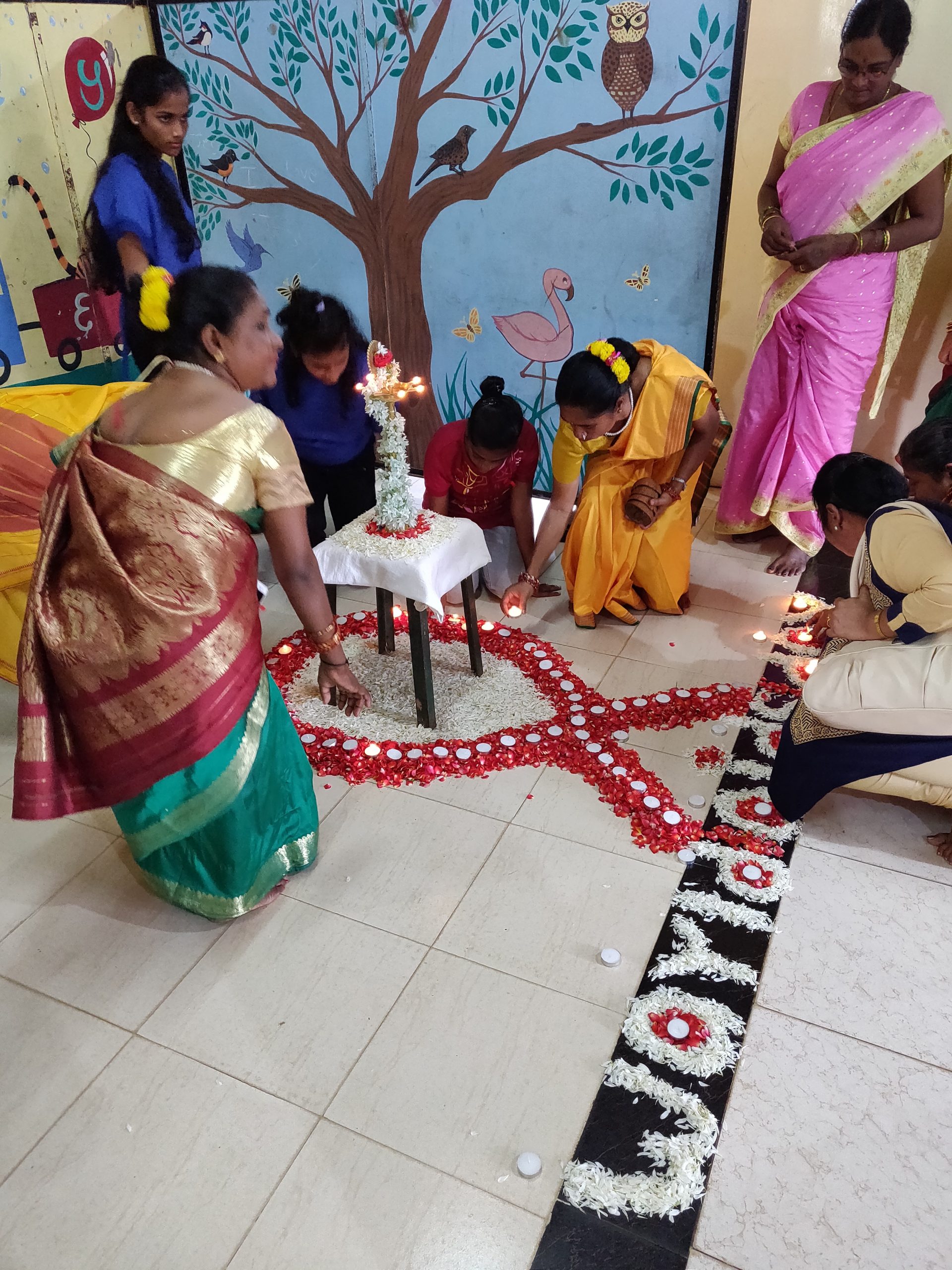 Women from the Sunflower Project lighting candles on World AIDS Day