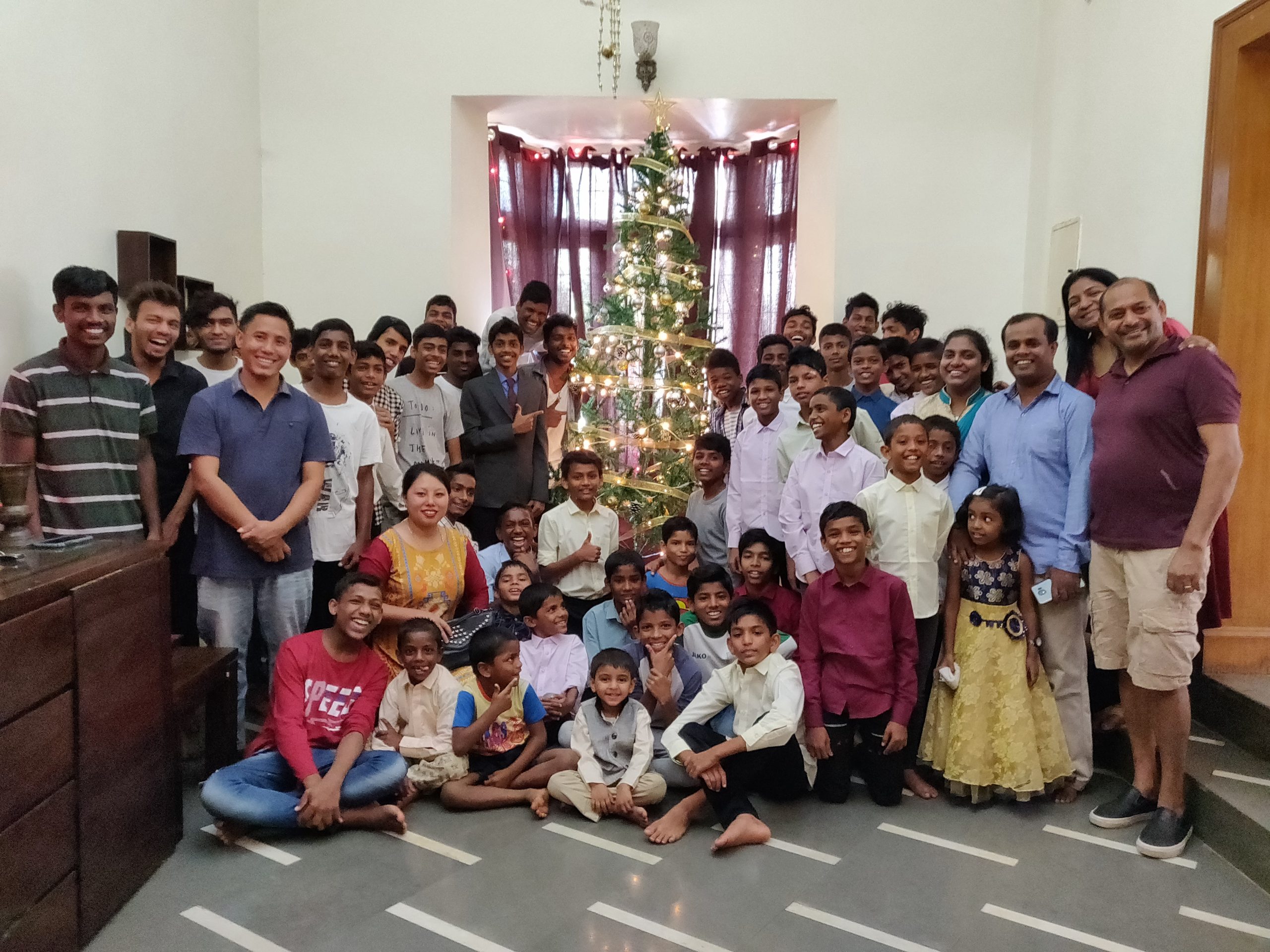 Junior boys, senior boys and their wardens on Christmas Day